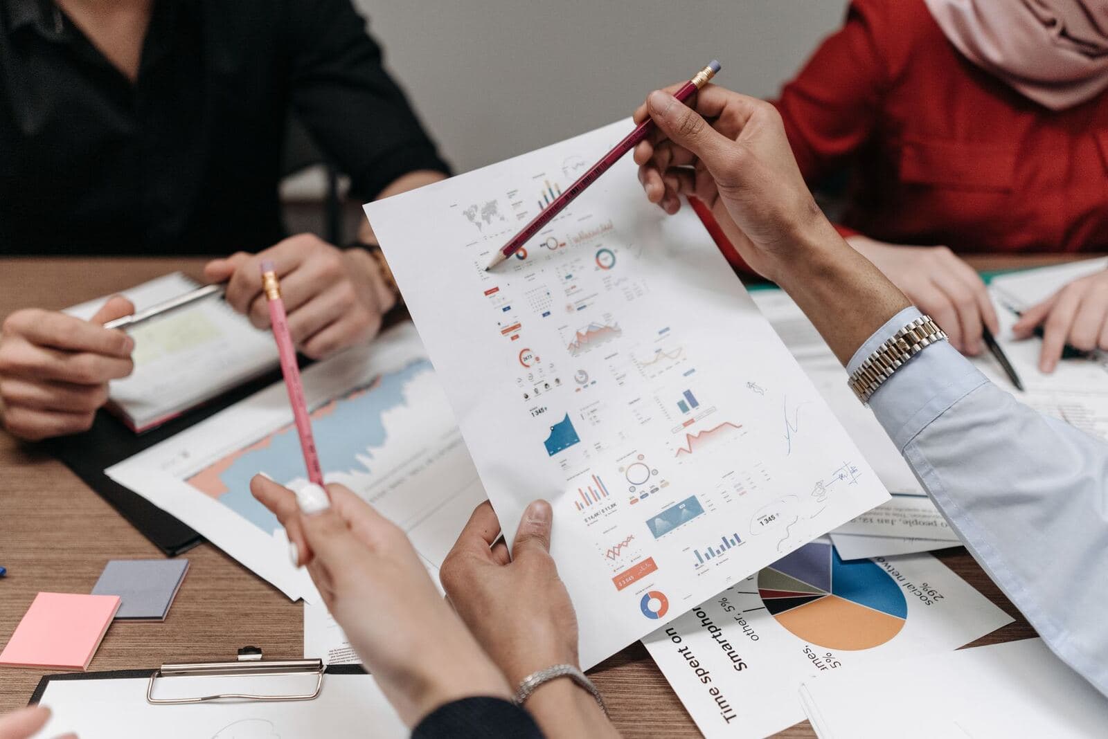Business team planning growth strategy around a table